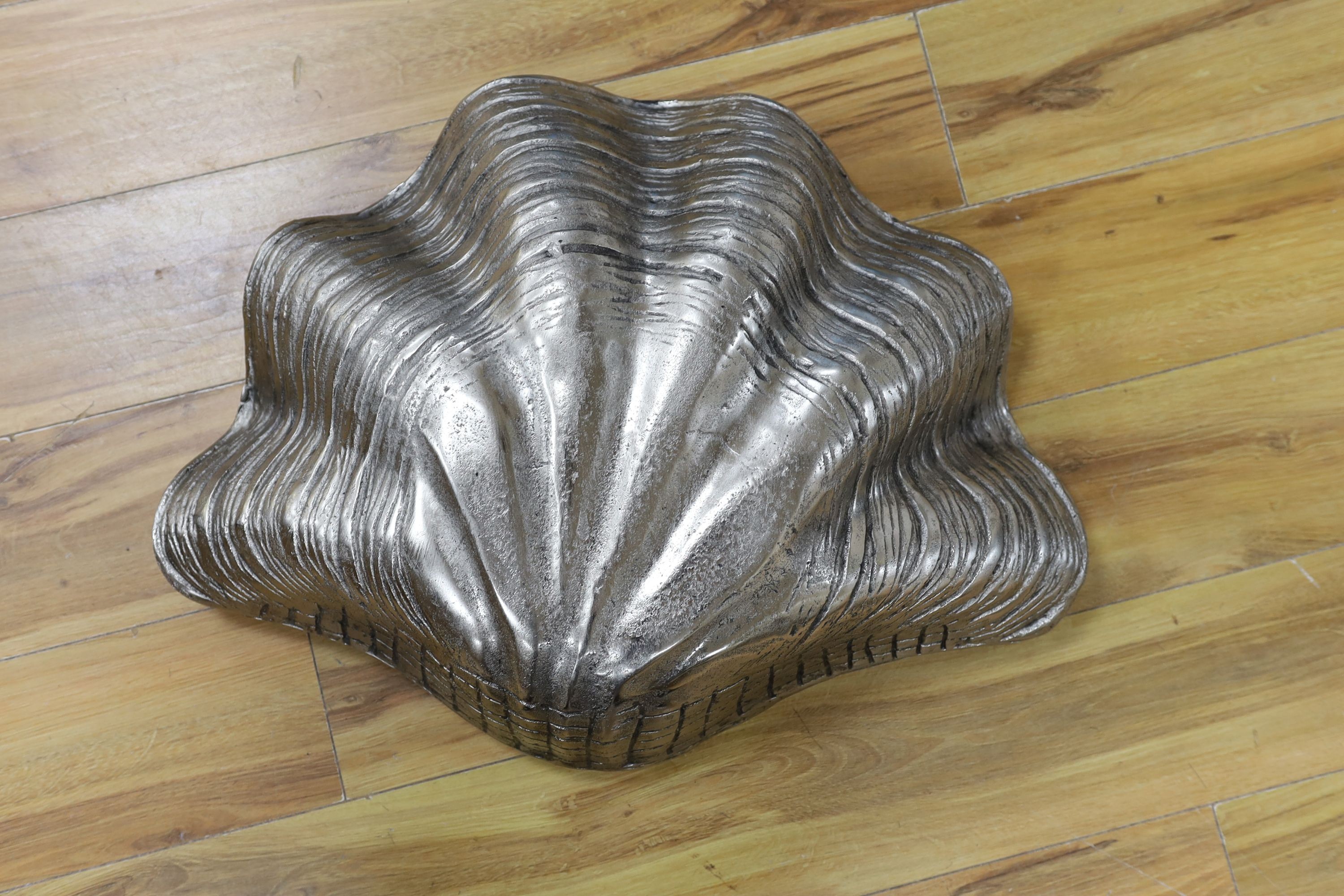 A cast aluminium clam-shaped ice bucket, 66 cms wide.